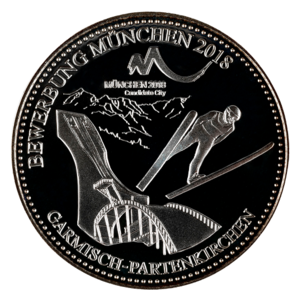 Münze mit der Skisprungschanze von Garmisch-Partenkirchen und einem Skispringer